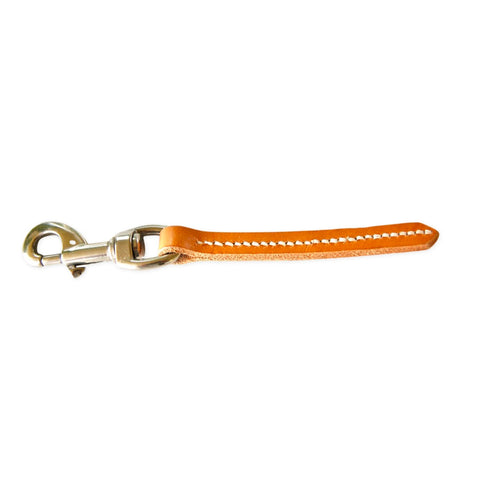 A light brown leather pull tab with white stitching and a silver-tone metal swivel clasp.