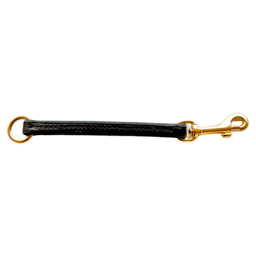 A black leather pull tab accessory with solid brass hardware, including a swivel snap hook and a ring.
